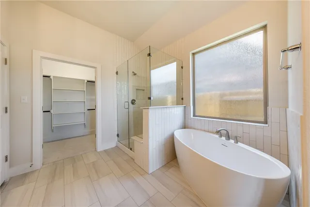 a bathroom with a double vanity sink mirror and shower