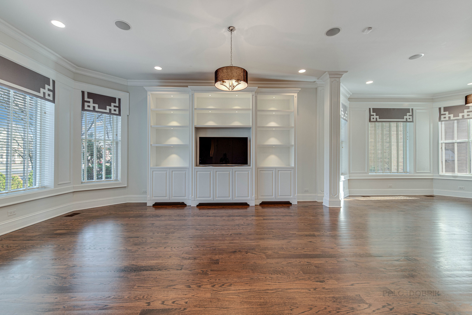 3051 West Logan Boulevard Chicago, IL 60647 - Photo 11 of 52 a view of an empty room with window and wooden floor