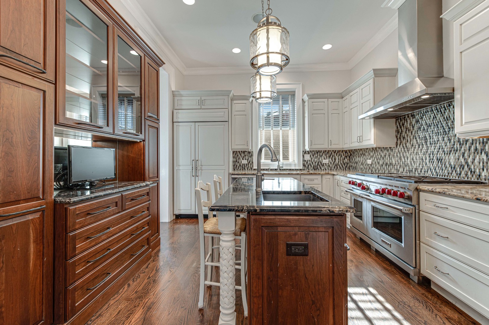 3051 West Logan Boulevard Chicago, IL 60647 - Photo 14 of 52 a kitchen with cabinets a sink and stainless steel appliances