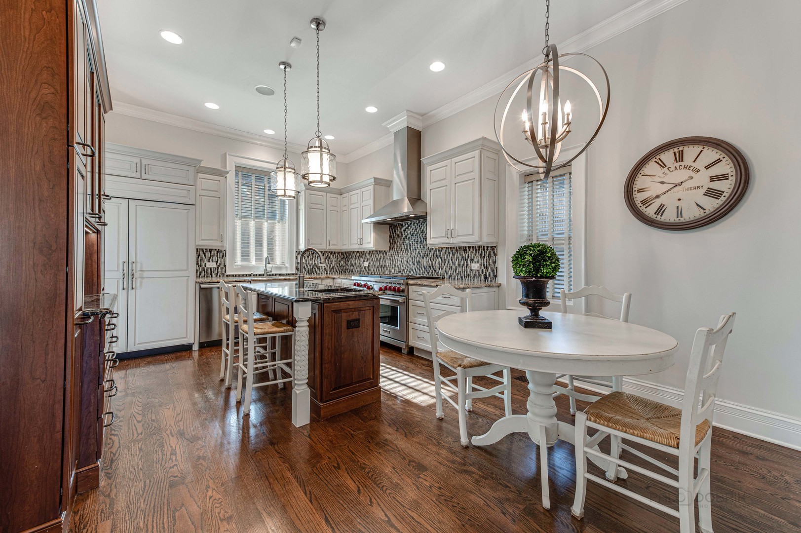 3051 West Logan Boulevard Chicago, IL 60647 - Photo 15 of 52 a view of a dining room with furniture a chandelier and wooden floor