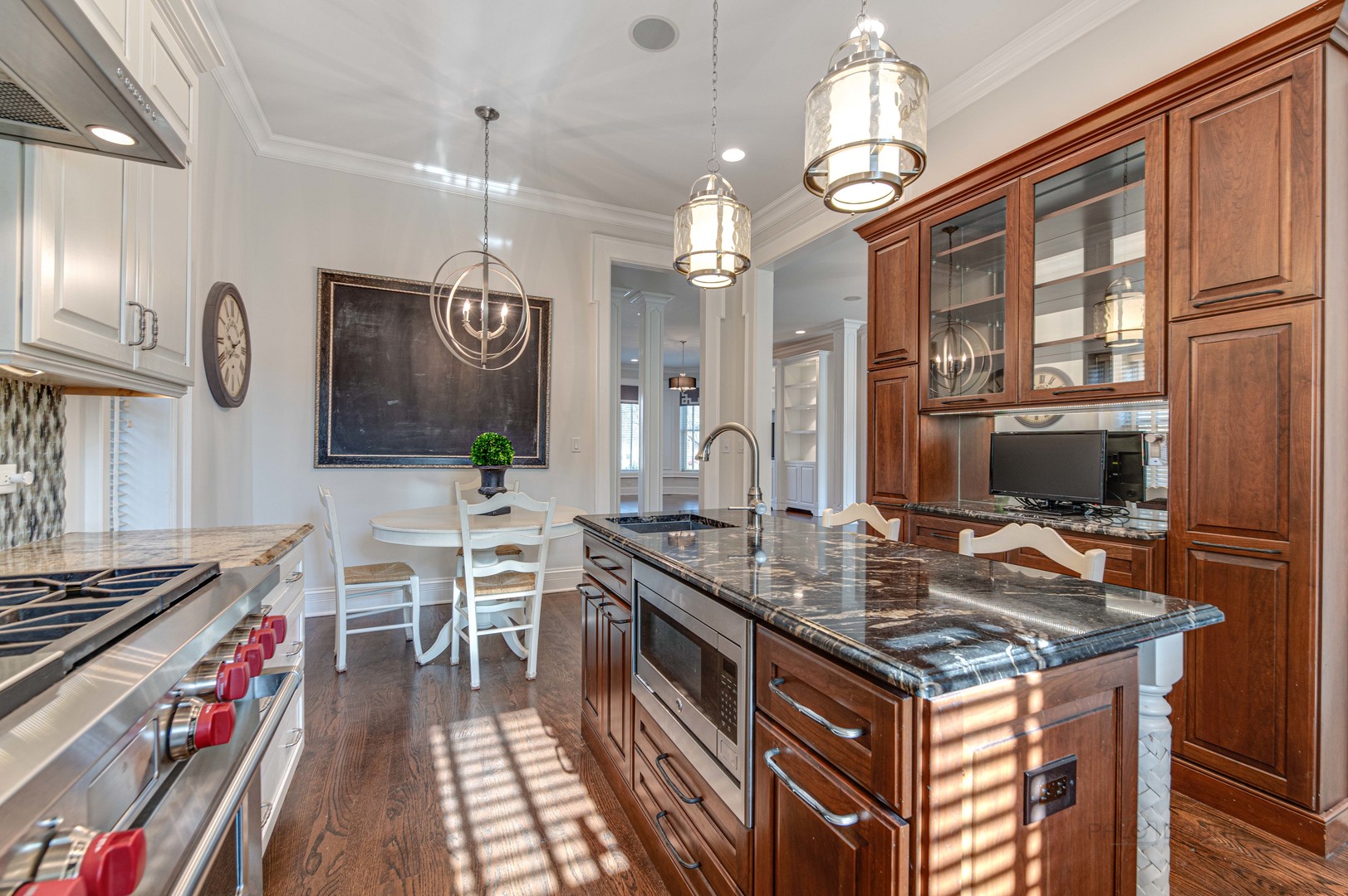3051 West Logan Boulevard Chicago, IL 60647 - Photo 17 of 52 a kitchen with a stove and a chandelier