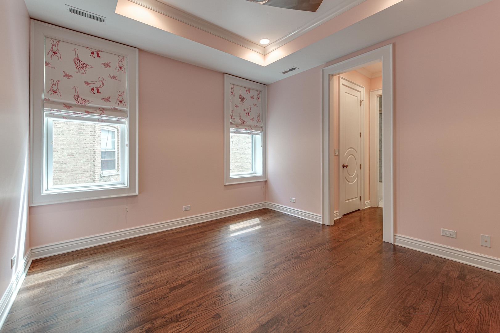 3051 West Logan Boulevard Chicago, IL 60647 - Photo 26 of 52 an empty room with wooden floor and window