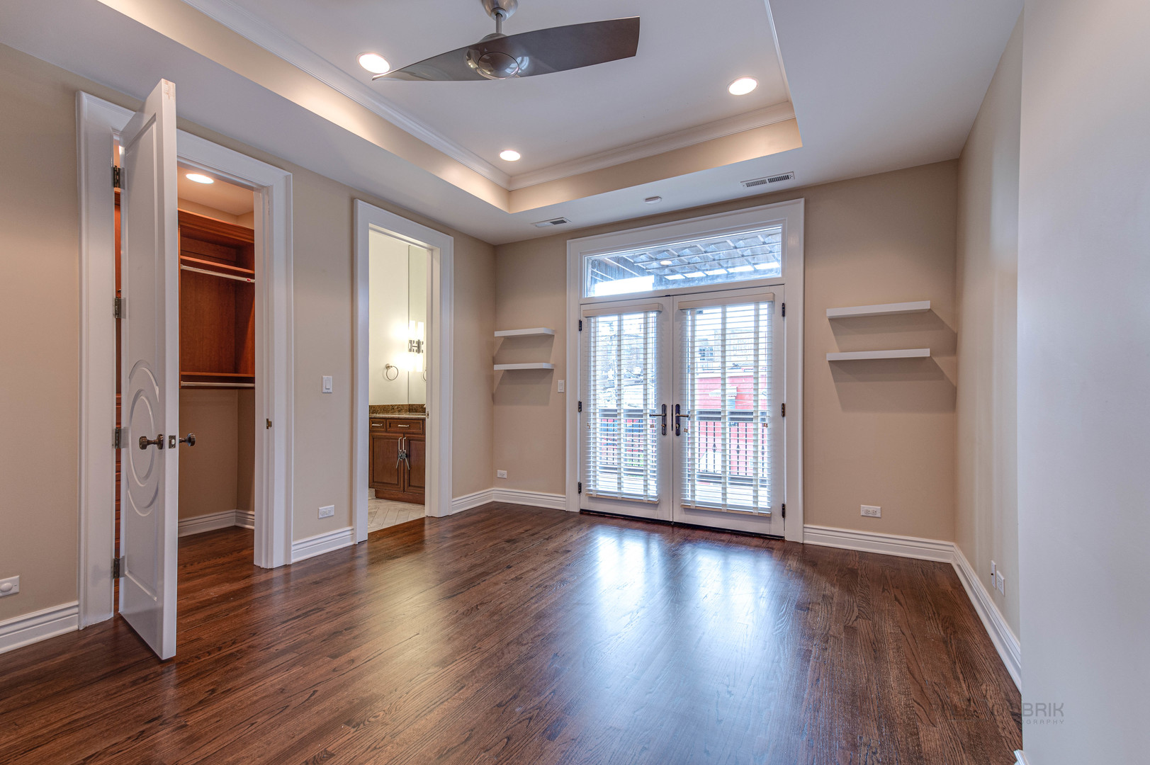 3051 West Logan Boulevard Chicago, IL 60647 - Photo 30 of 52 a view of an empty room with wooden floor and a window