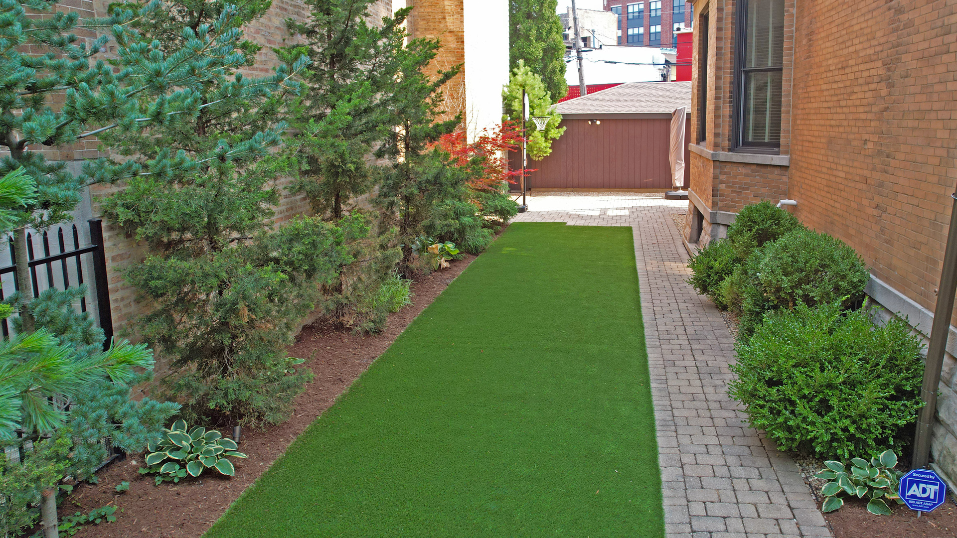 3051 West Logan Boulevard Chicago, IL 60647 - Photo 3 of 52 a view of a house with a yard and plants
