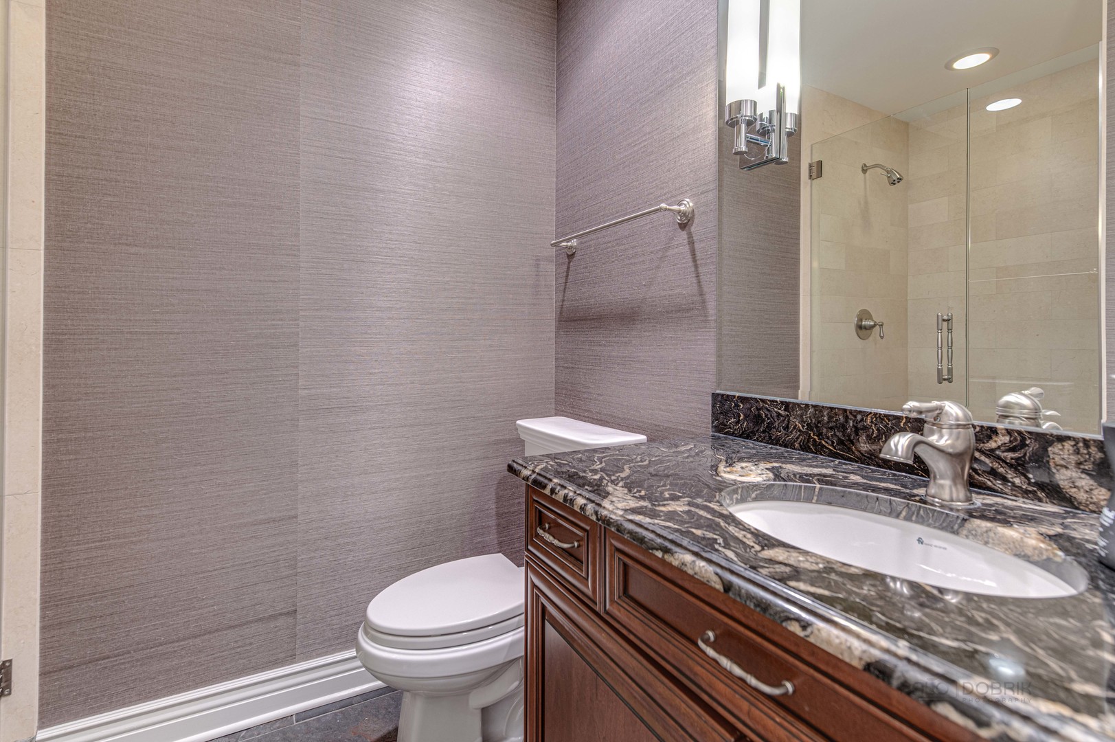 3051 West Logan Boulevard Chicago, IL 60647 - Photo 42 of 52 a bathroom with a granite countertop sink toilet and a mirror
