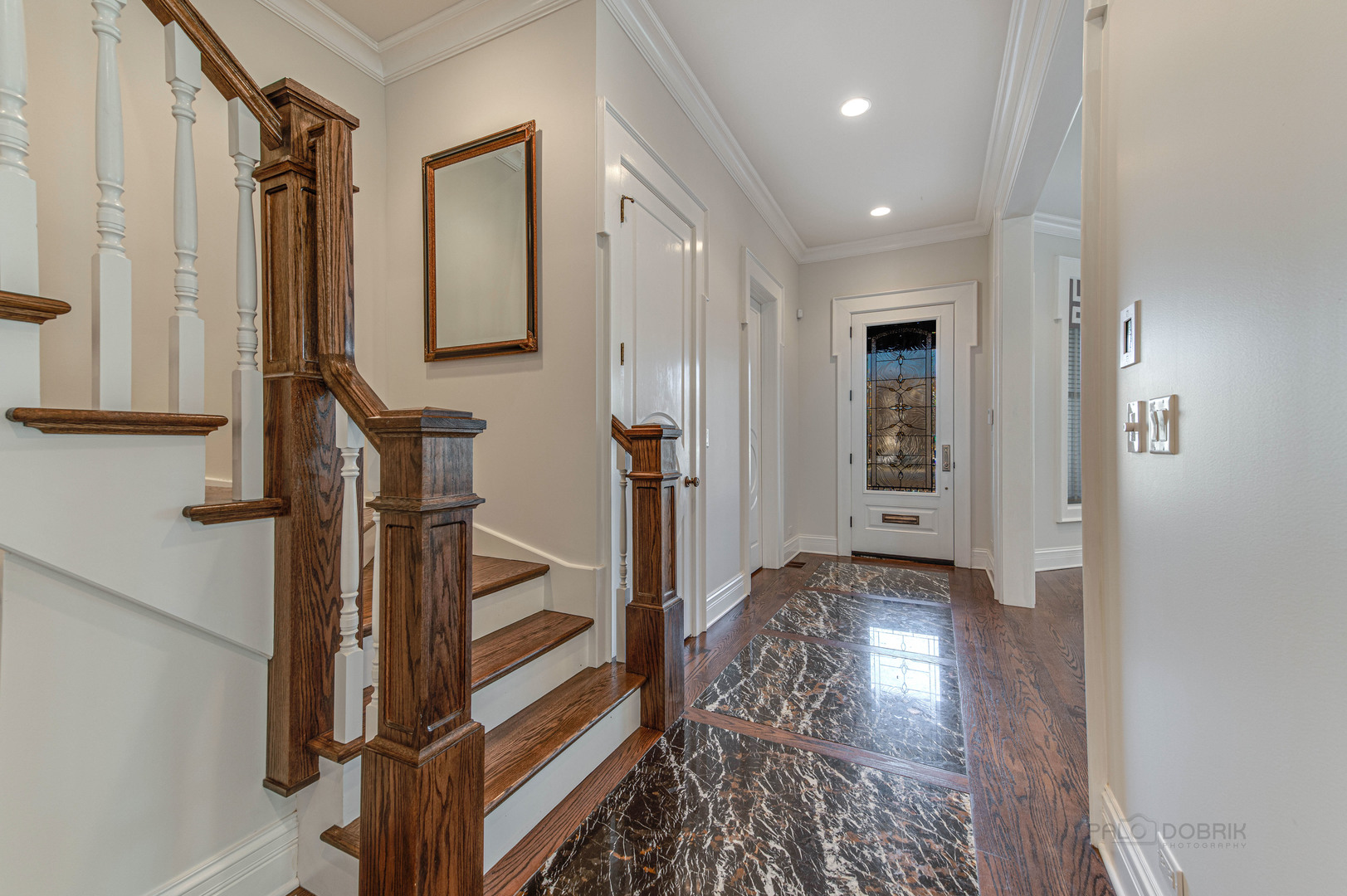 3051 West Logan Boulevard Chicago, IL 60647 - Photo 5 of 52 a view of entryway with wooden floor and stairs