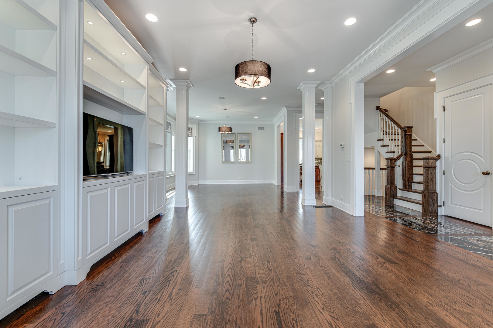 3051 West Logan Boulevard Chicago, IL 60647 - Photo 8 of 52 a view of a hallway with wooden floor and a kitchen