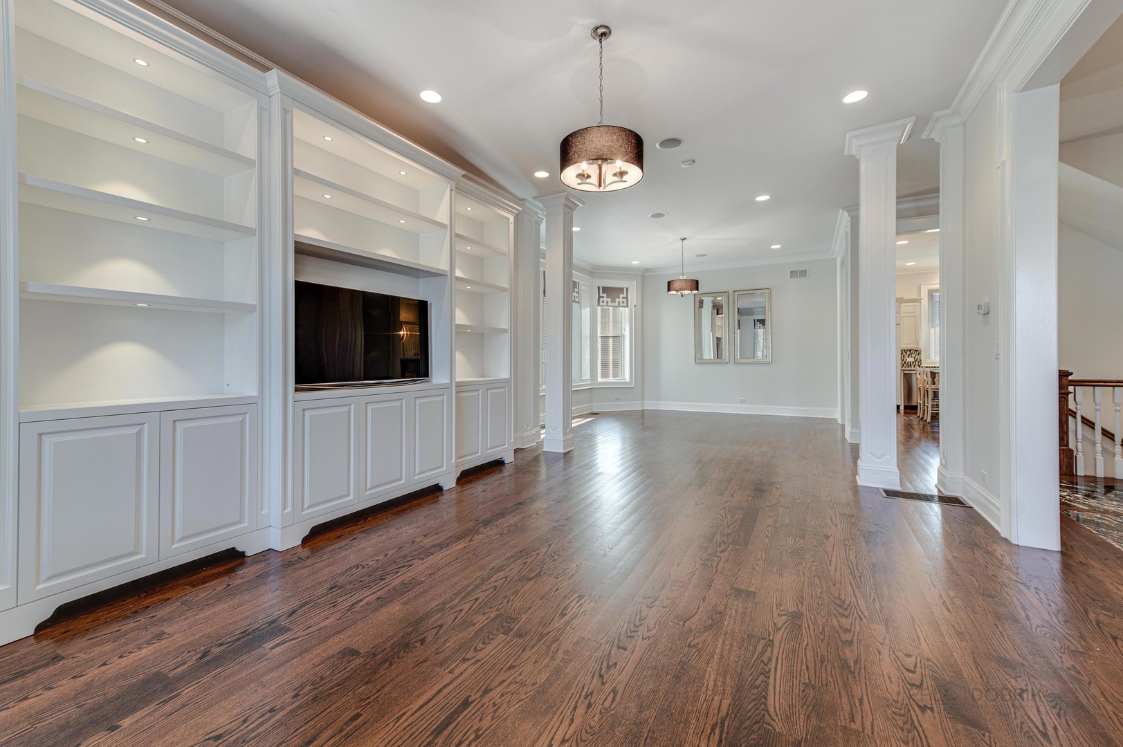3051 West Logan Boulevard Chicago, IL 60647 - Photo 10 of 52 a view of a big room with wooden floor and a kitchen