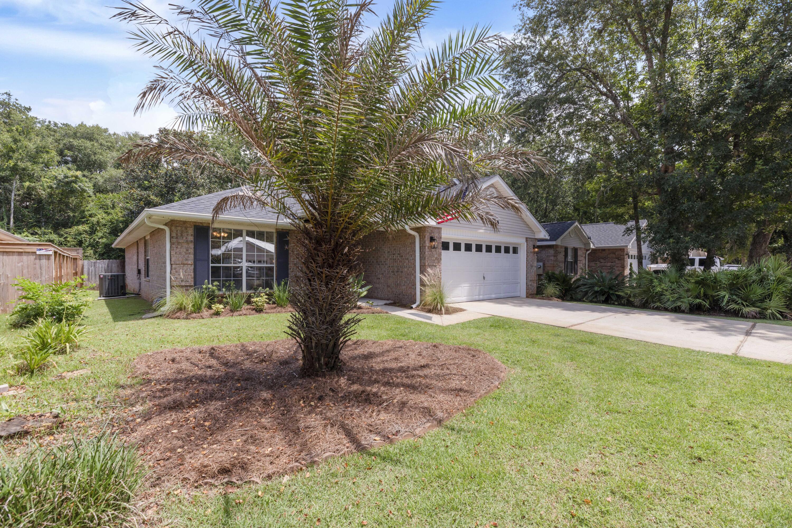 50 Bayou Landing Road Santa Rosa Beach, FL 32459 - Photo 2 of 40 a front view of a house with a yard and trees