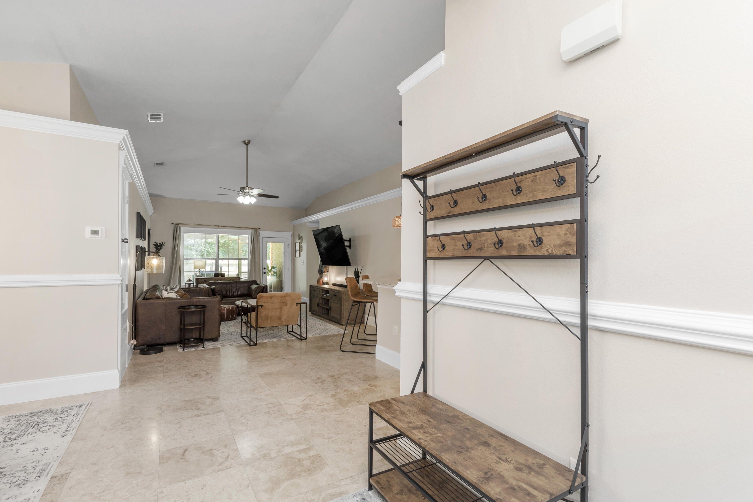 50 Bayou Landing Road Santa Rosa Beach, FL 32459 - Photo 5 of 40 a living room with furniture a flat screen tv and next to a window