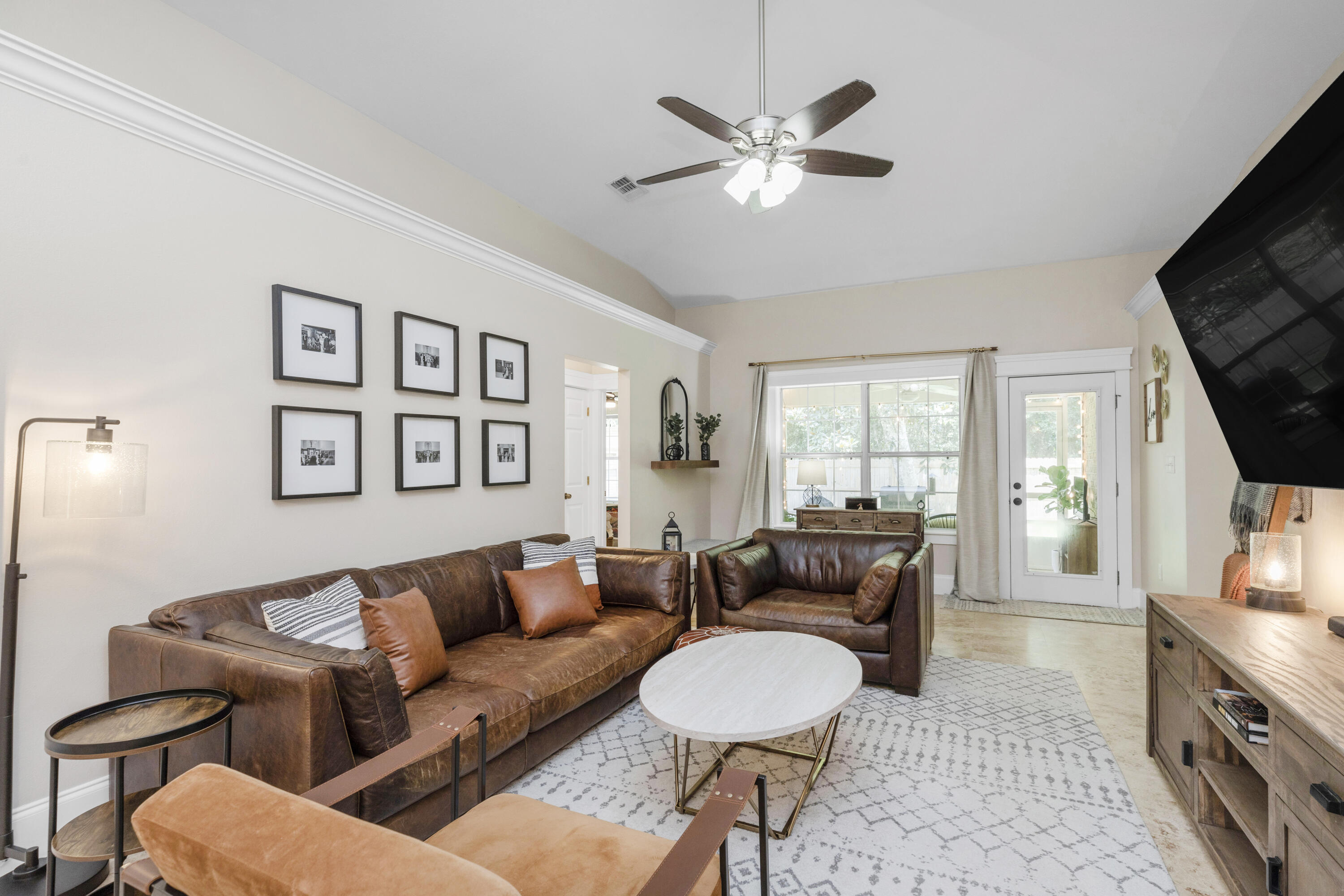 50 Bayou Landing Road Santa Rosa Beach, FL 32459 - Photo 9 of 40 a living room with furniture and a flat screen tv