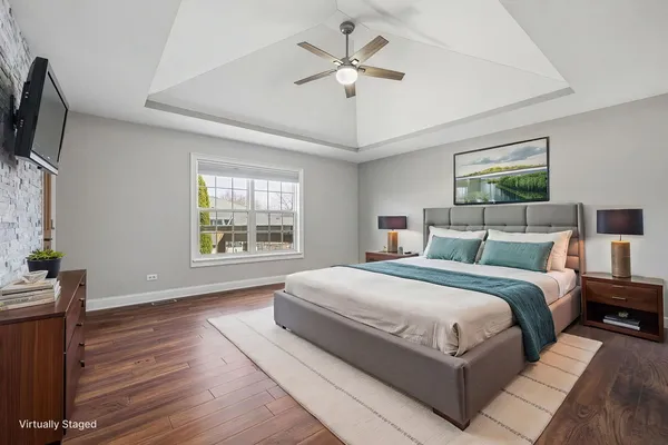 a spacious bedroom with a large bed and a window