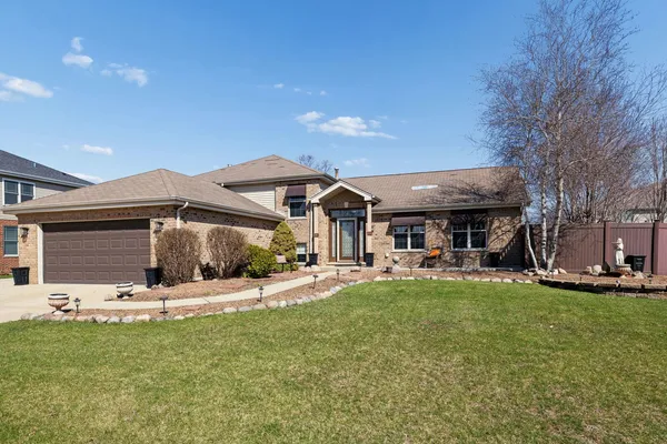 a view of a house with patio and sitting area