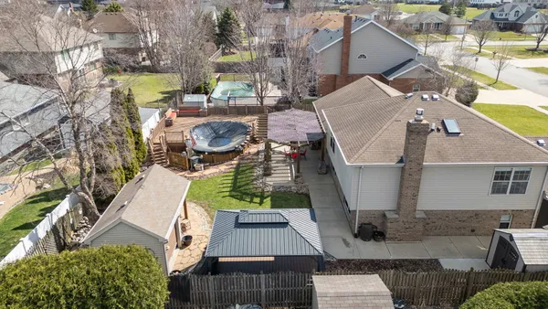 a view of a house with yard and sitting area