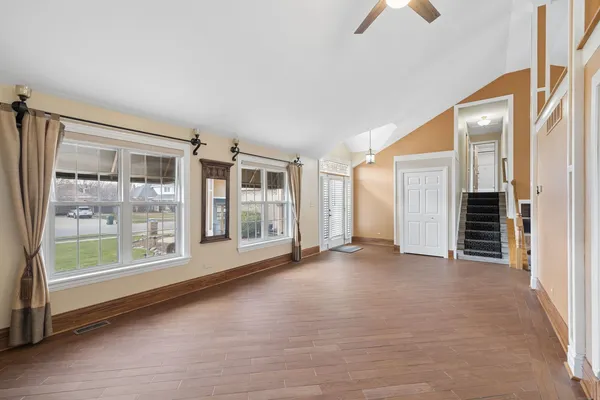 en empty room with windows and outdoor view