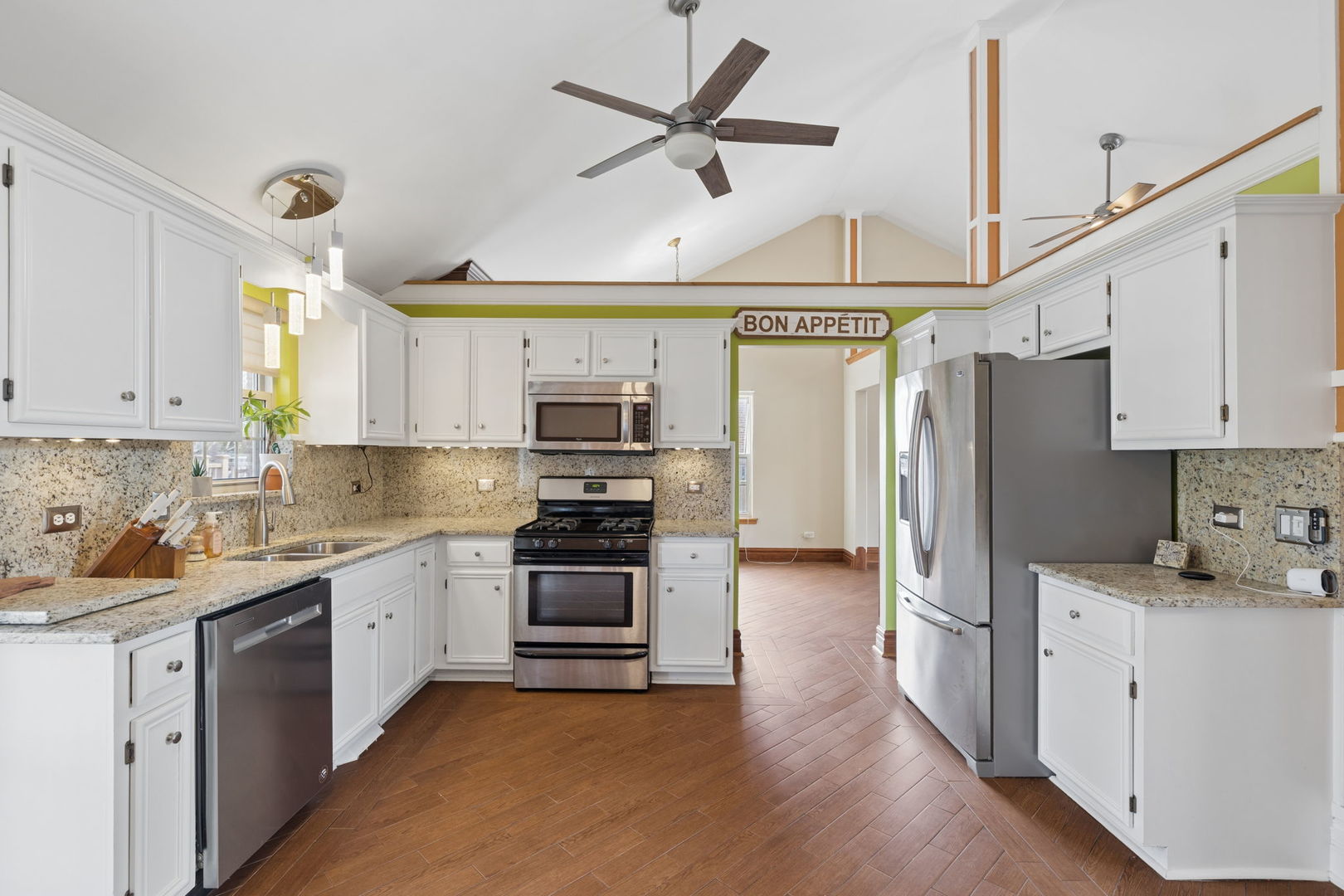 1035 Yamma Ridge New Lenox, IL 60451 - Photo 10 of 51 a kitchen with stainless steel appliances a stove a sink dishwasher a refrigerator and white cabinets with wooden floor