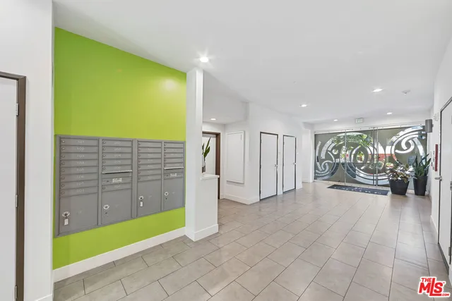 a view of a roof deck with furniture