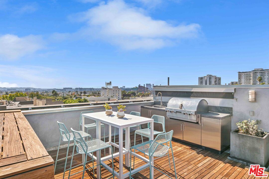 1232 North Kings Road, Unit 105 West Hollywood, CA 90069 - Photo 17 of 22 a view of a roof deck with furniture