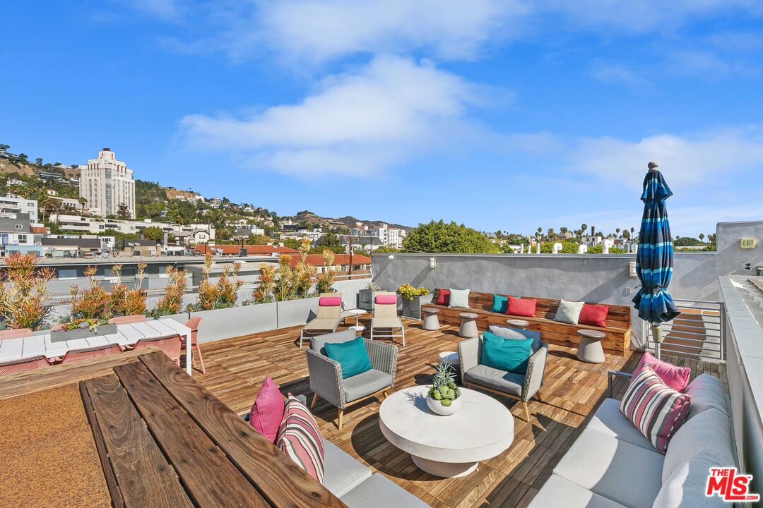 1232 North Kings Road, Unit 105 West Hollywood, CA 90069 - Photo 18 of 22 a terrace with outdoor seating