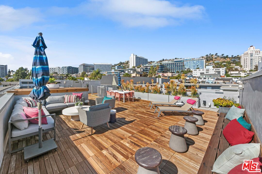 1232 North Kings Road, Unit 105 West Hollywood, CA 90069 - Photo 19 of 22 a view of city from terrace along with seating space