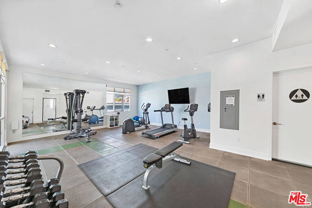 1232 North Kings Road, Unit 105 West Hollywood, CA 90069 - Photo 21 of 22 a view of a room with gym equipment