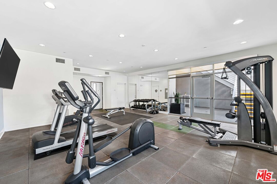 1232 North Kings Road, Unit 105 West Hollywood, CA 90069 - Photo 22 of 22 a view of a room with gym equipment