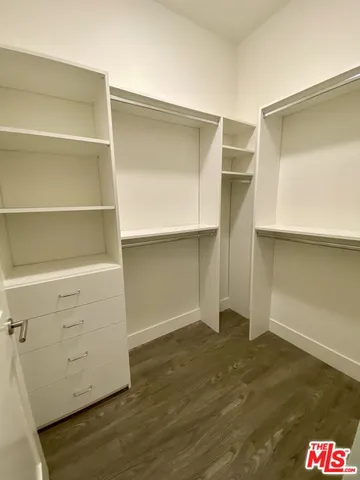 a room with a hardwood floor and closet