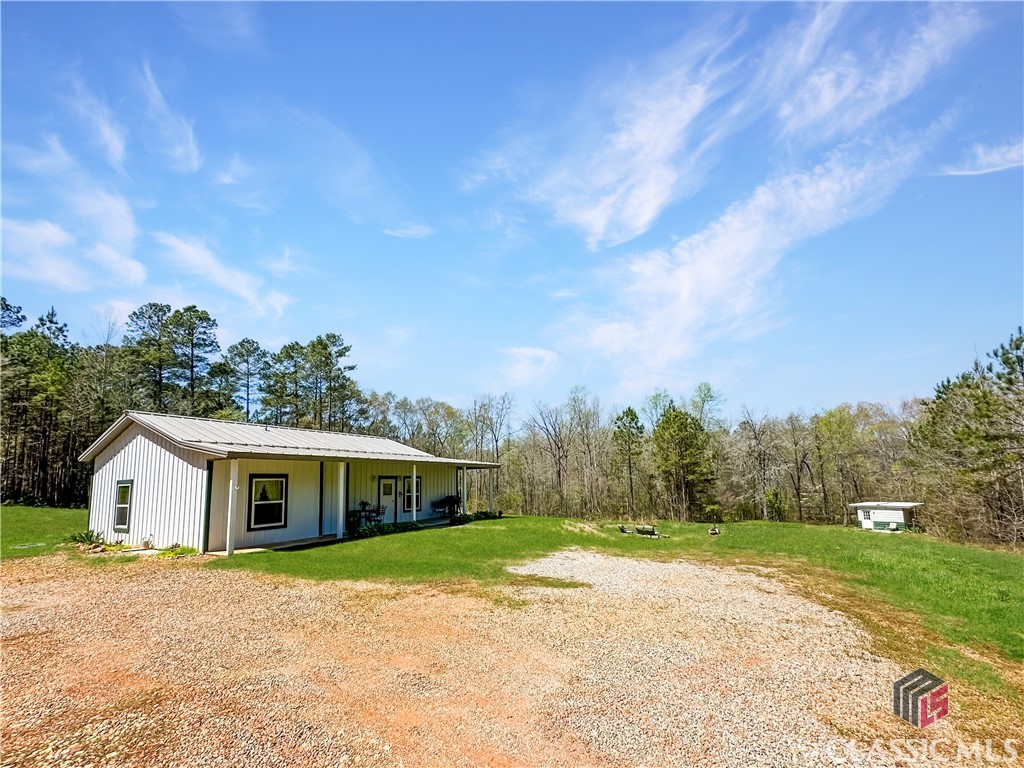 855 Steven's Grove Church Road Lexington, GA 30648 - Photo 24 of 51 Home w/Cabin in background
