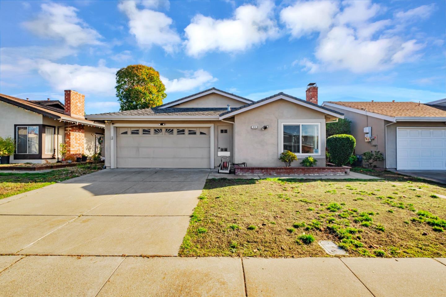 a front view of a house with a yard