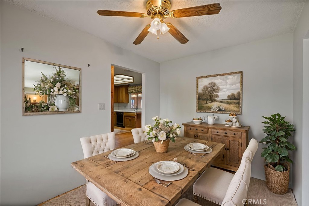 2065 Jenkins Road Bakersfield, CA 93314 - Photo 22 of 59 a view of a dining room with furniture and wooden floor