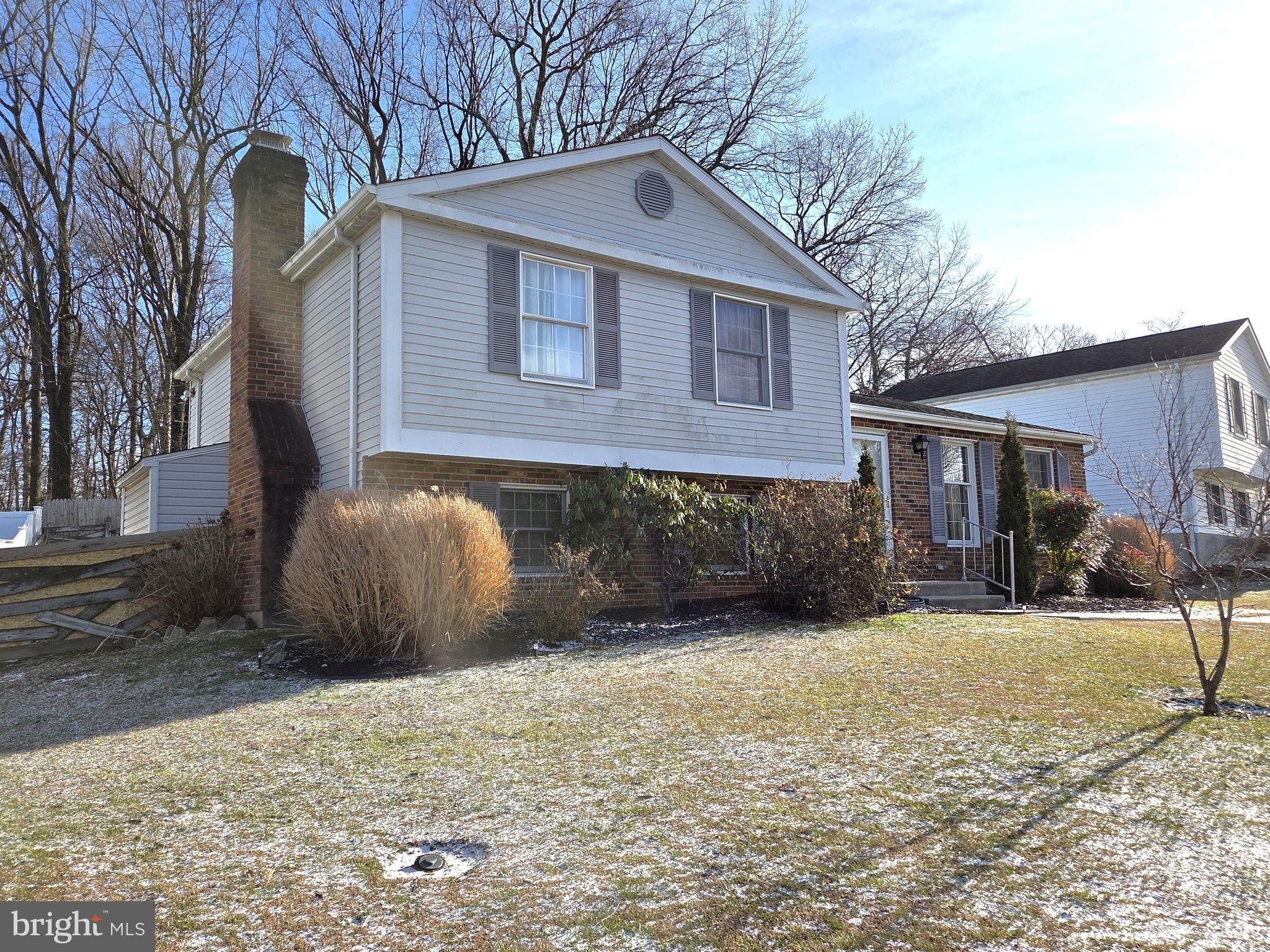 542 Fuselage Avenue Baltimore, MD 21221 - Photo 2 of 5 a front view of a house with a yard and garage