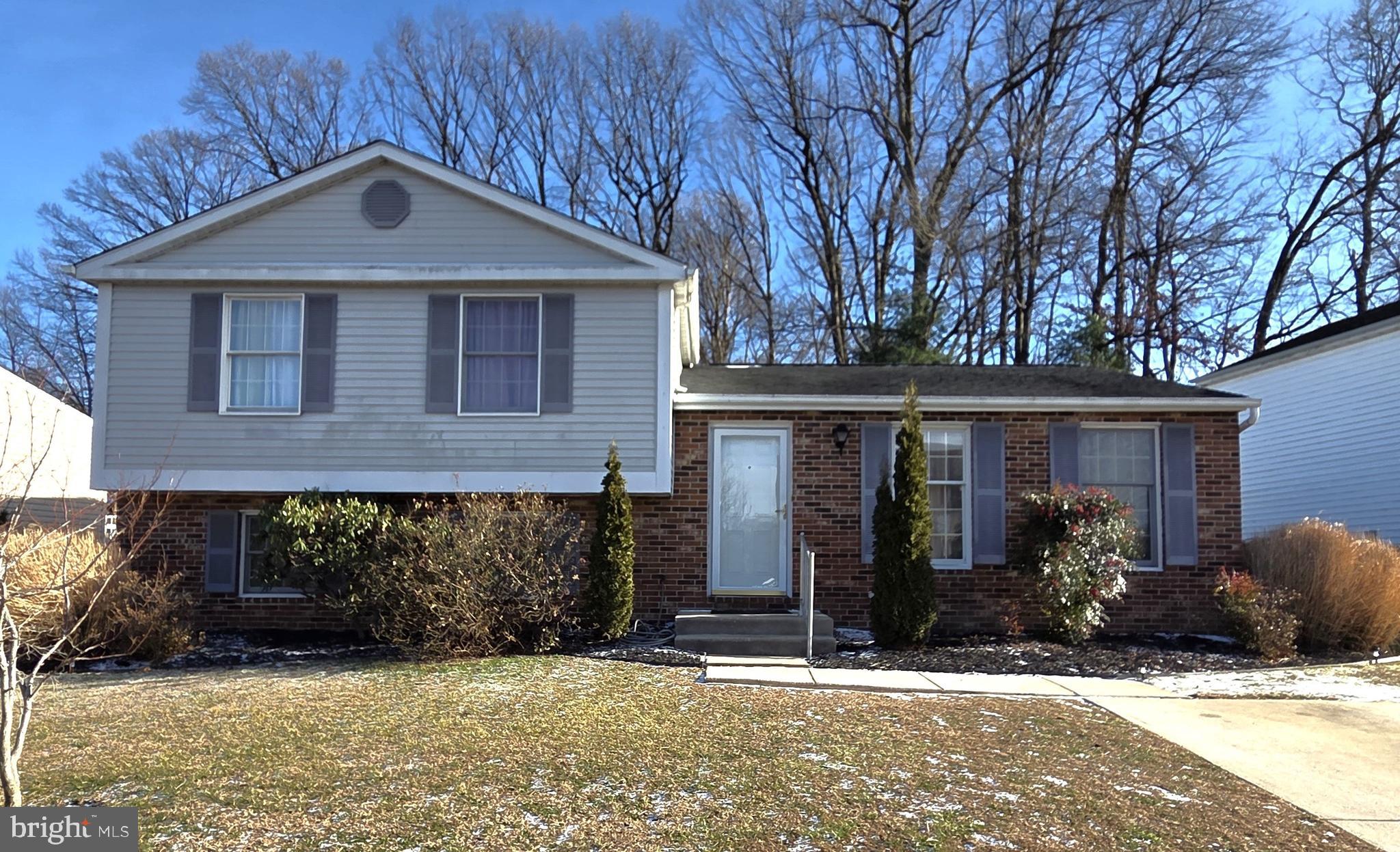542 Fuselage Avenue Baltimore, MD 21221 - Photo 5 of 5 a front view of a house with garden