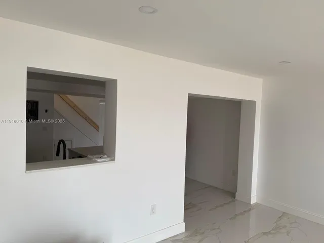 a view of a room that has a sink