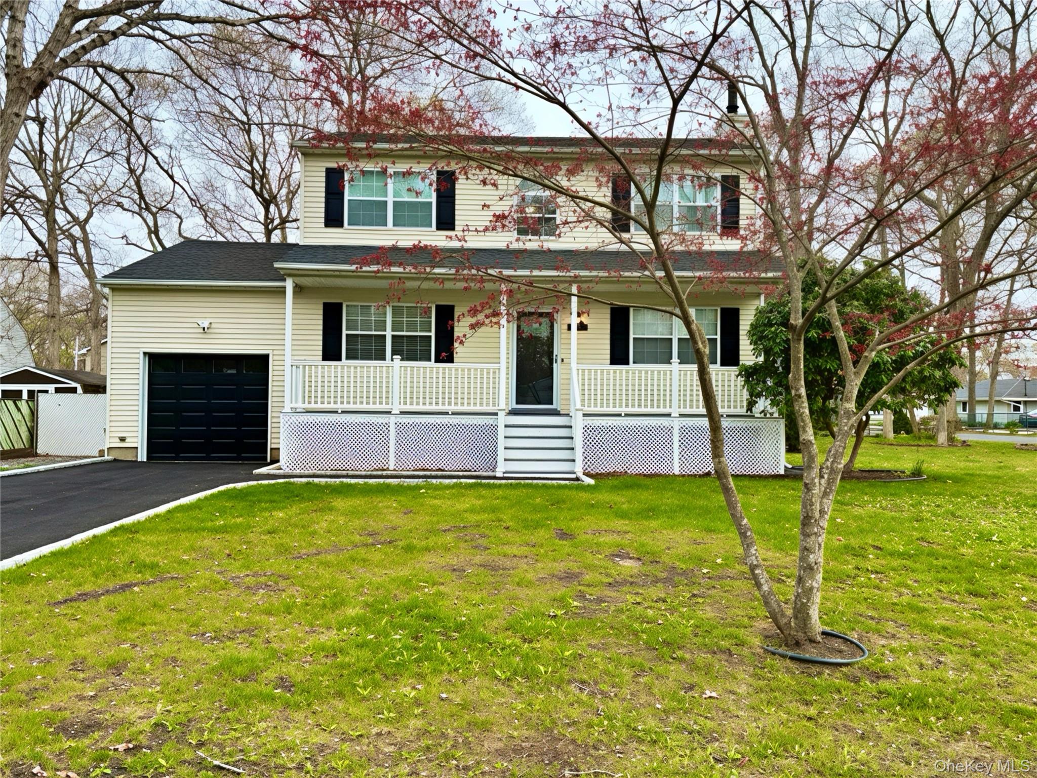 80 Queen Road Mastic Beach, NY 11951 - Photo 31 of 32 New black top driveway with stone border and recently seeded lawn