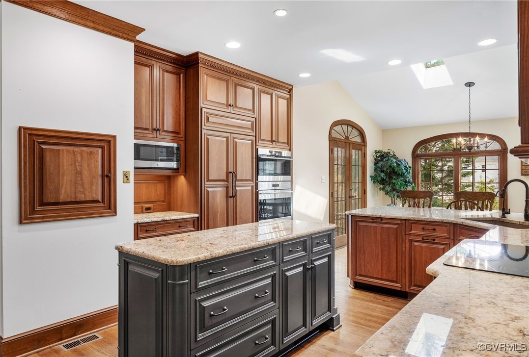 5219 Clipper Cove Road Midlothian, VA 23112 - Photo 15 of 49 a view of a kitchen with granite countertop a sink and a refrigerator