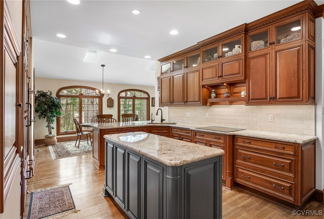 5219 Clipper Cove Road Midlothian, VA 23112 - Photo 16 of 49 a kitchen with stainless steel appliances granite countertop a stove a sink and a microwave