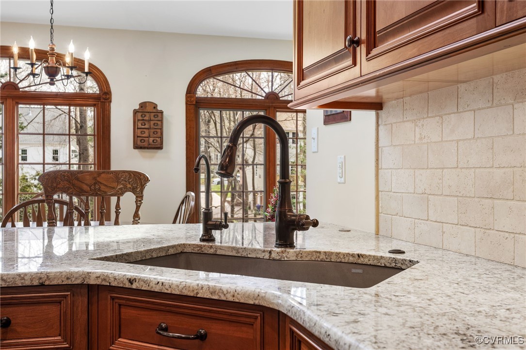 5219 Clipper Cove Road Midlothian, VA 23112 - Photo 17 of 49 a view of a kitchen with granite countertop a sink and a large window