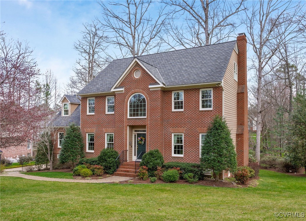 5219 Clipper Cove Road Midlothian, VA 23112 - Photo 2 of 49 a front view of a house with a yard and trees