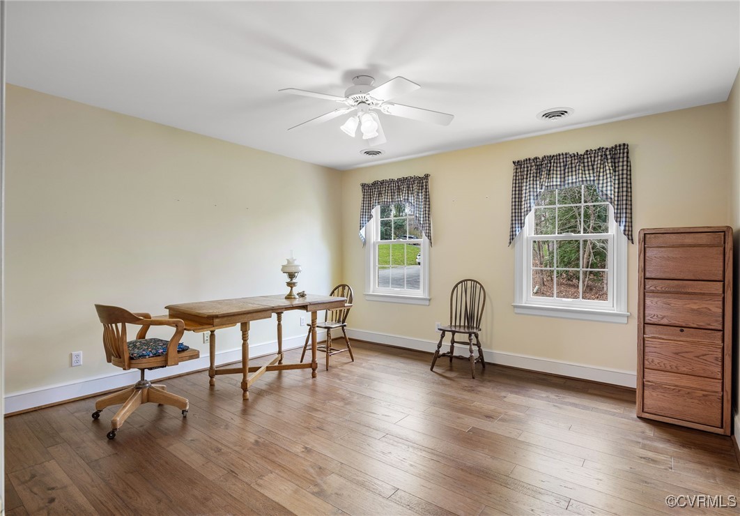 5219 Clipper Cove Road Midlothian, VA 23112 - Photo 32 of 49 a workspace with wooden floor and windows