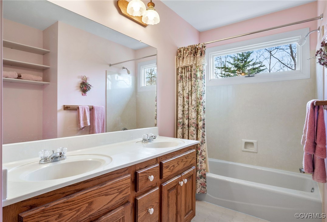 5219 Clipper Cove Road Midlothian, VA 23112 - Photo 36 of 49 a bathroom with a tub sink and mirror