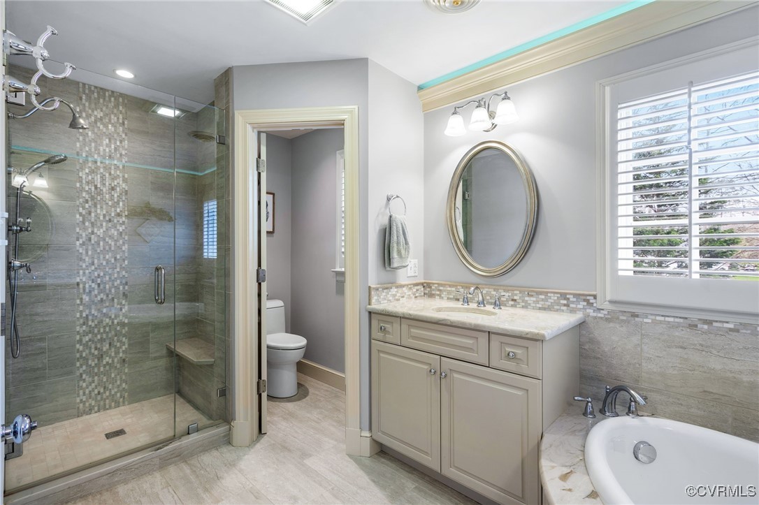 5219 Clipper Cove Road Midlothian, VA 23112 - Photo 39 of 49 a bathroom with a sink a toilet and shower