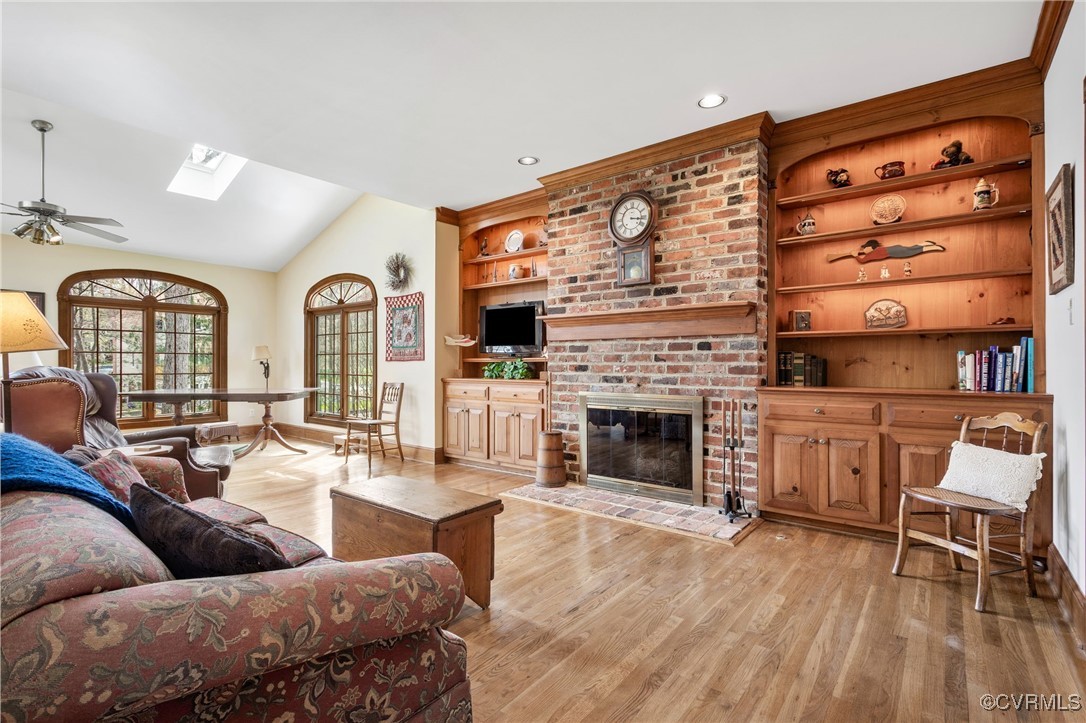 5219 Clipper Cove Road Midlothian, VA 23112 - Photo 7 of 49 a living room with furniture and a fireplace
