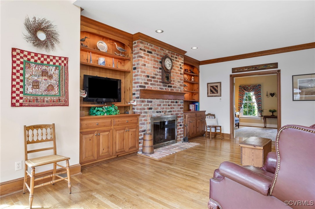 5219 Clipper Cove Road Midlothian, VA 23112 - Photo 8 of 49 a living room with furniture and a fireplace