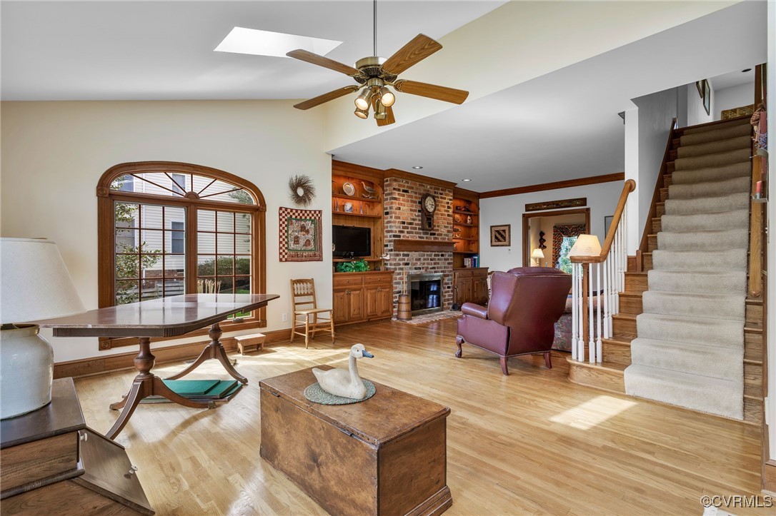 5219 Clipper Cove Road Midlothian, VA 23112 - Photo 10 of 49 a living room with furniture a fireplace and a flat screen tv