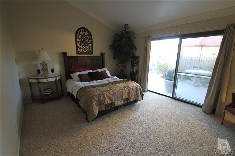 3948 Southhampton Road Moorpark, CA 93021 - Photo 12 of 30 a bedroom with a bed painting and a large window