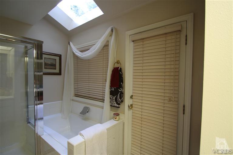 3948 Southhampton Road Moorpark, CA 93021 - Photo 15 of 30 a bathroom with a sink a toilet and shower