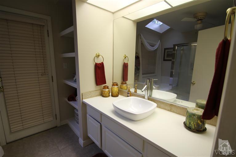 3948 Southhampton Road Moorpark, CA 93021 - Photo 17 of 30 a bathroom with a sink and a mirror