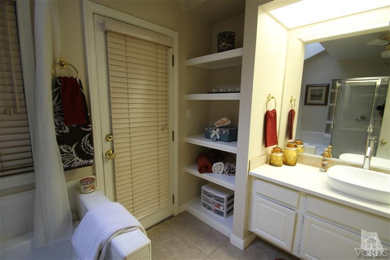 3948 Southhampton Road Moorpark, CA 93021 - Photo 18 of 30 a bathroom with a sink and a mirror