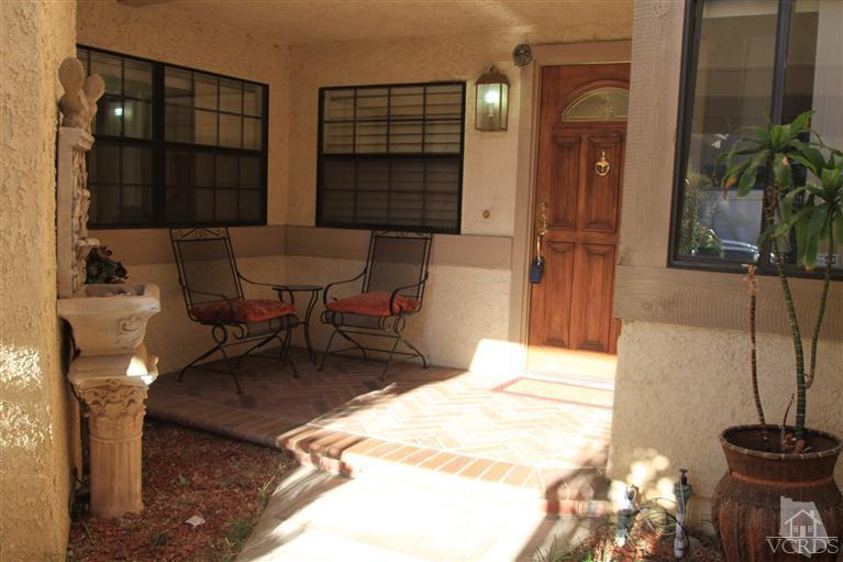 3948 Southhampton Road Moorpark, CA 93021 - Photo 3 of 30 a living room with furniture a window and a potted plant