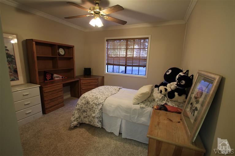 3948 Southhampton Road Moorpark, CA 93021 - Photo 23 of 30 a bedroom with a bed and a television